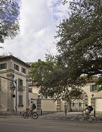 Computer rendering of cyclists passing by the gate to the Vizcaya Vllage.