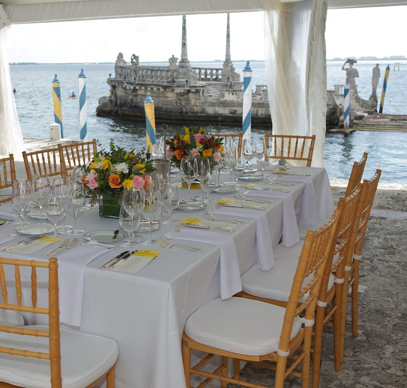 Simple and classic daytime event set up on the East Terrace, with Biscayne Bay and the Barge in the background.