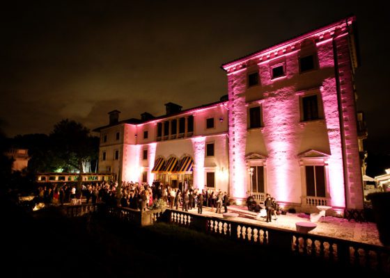 Evening reception on the East Terrace with pink uplights.