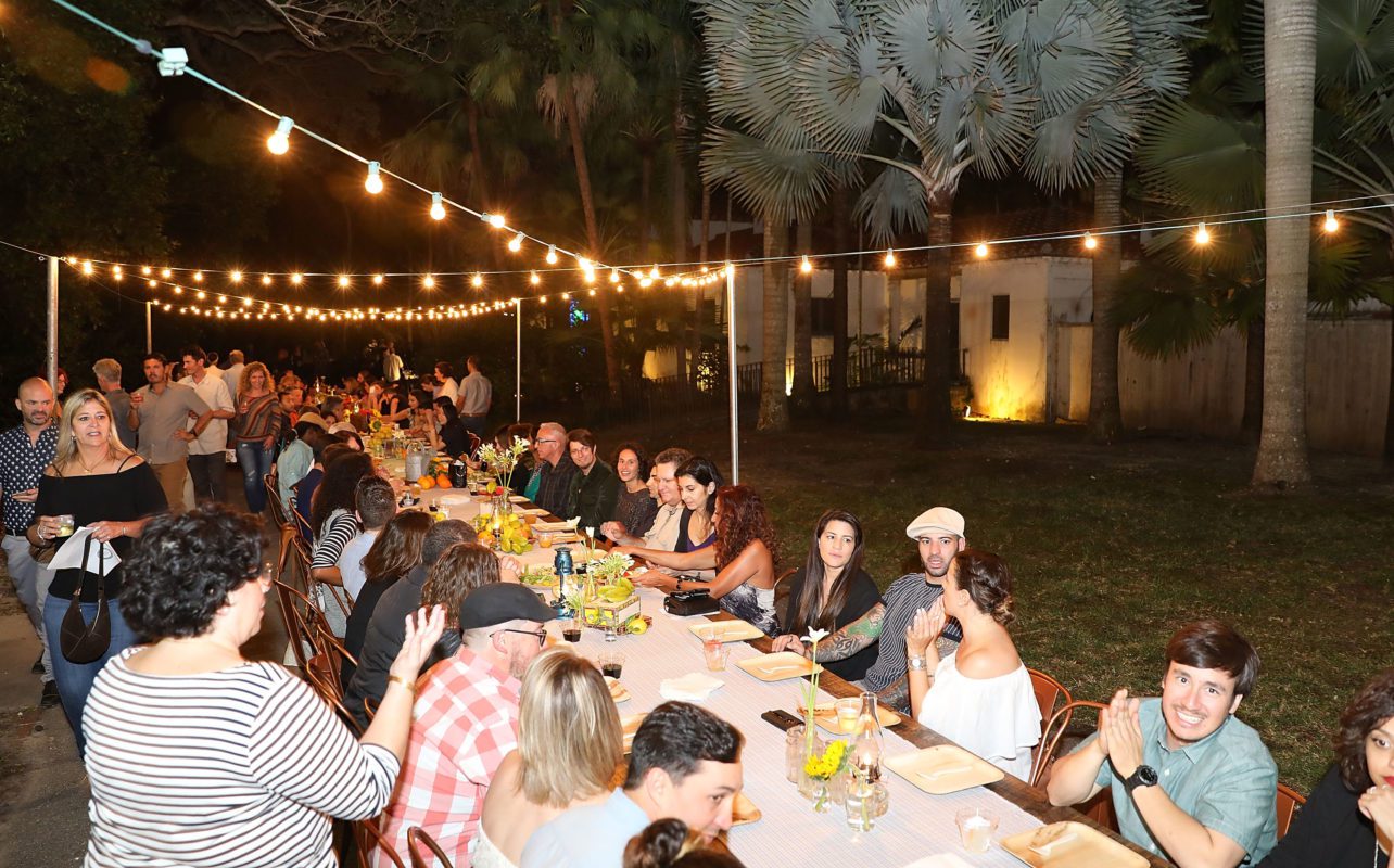 Local farmers gather, family style, at Vizcaya's Dinner for Farmers in Vizcaya Village. Photo by Ben Thacker.
