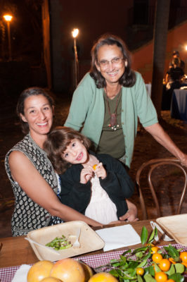 Two women and a young girl posing for photo at Dinner for Farmers.