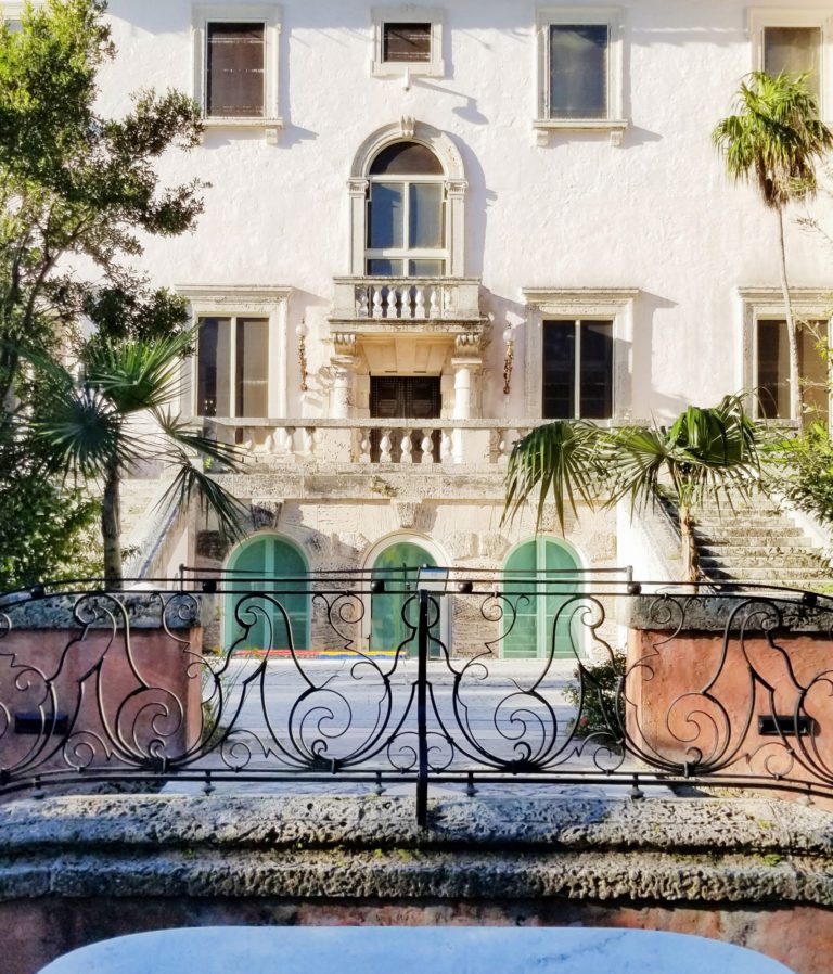 The North side of Vizcaya's Main House, which sits directly across from the Orchidarium. Photo shows the steps and balcony with three closed glass doors that lead to the basement.