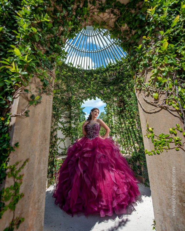 Teen girl in purple ball gown in a gazebo for her quinceañera photo session.