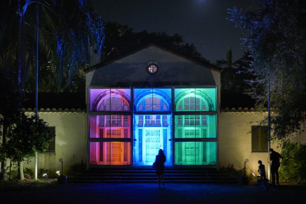 The Superintendent's House in Vizcaya Village, with red, blue and green lighting as part of a 2017 Contemporary Arts Program installation. Photo by David Almeida.