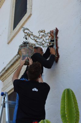 Light fixture being removed from the Main House.