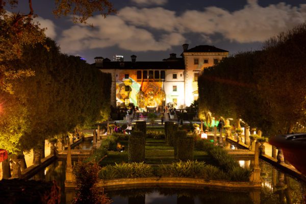 Vizcaya's main House is illuminated with light projections during Spectral Vizcaya