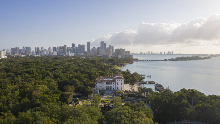 Aerial photo of Vizcaya and its formal gardens with downtown Miami in the background