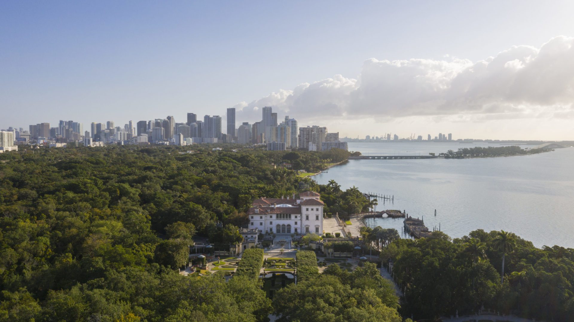 Aerial photo of Vizcaya and its formal gardens with downtown Miami in the background. Photo by Robin Hill