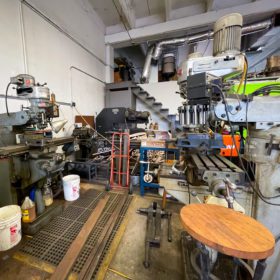 Blacksmith shop featuring various tools and machines