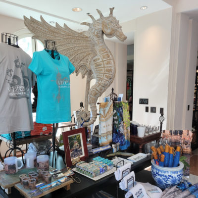 Gift shop featuring a giant seahorse statue, t-shirts, umbrellas and other gifts