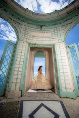 Love young girl in a yellow dress poses for her quince photos in the Tea House at Vizcaya. Photo by Sunlife Photography