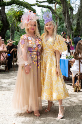Guests wearing spring attire in the gardens.