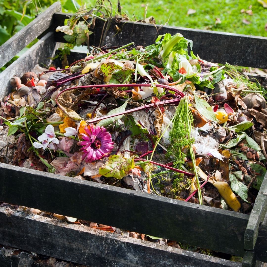 wooden box filled with composting materials