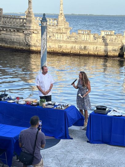 Chef Allen and Sara Curry of Slow Fish Miami speaking in at Vizcaya on the Lower East Terrace with the Barge in the background.