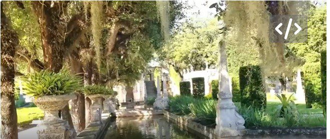 Vizcaya's center island, a water feature with large oak trees overhanging with spanish moss.