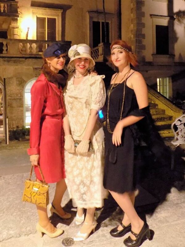 Three women dressed in 1920s attire
