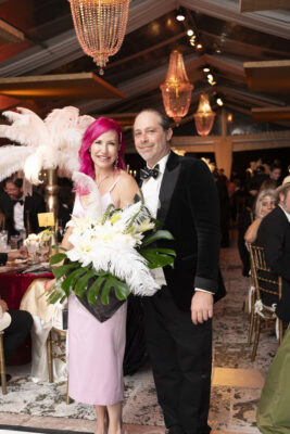 A man and woman posing for a photo at the Vizcaya Ball, a formal event.