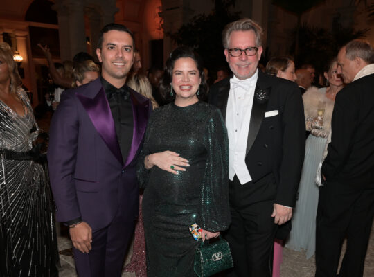 Three people posing for a photo at the Vizcaya Ball.