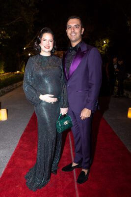 A man and woman posing for a photo on the red carpet at the Vizcaya Ball.