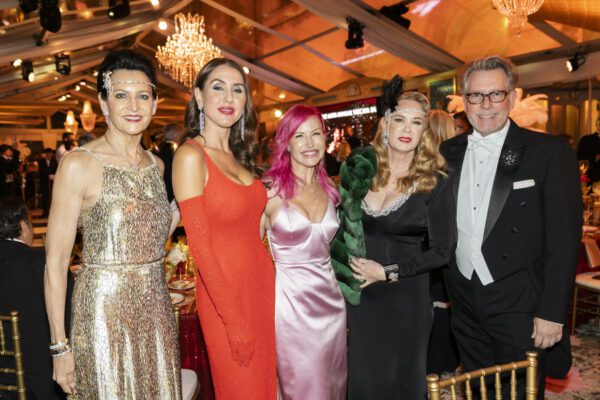 A group of people posing for a picture at the Vizcaya Ball, a formal event.