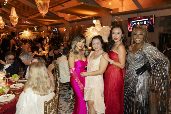 A group of women posing for a photo at the Vizcaya Ball event.
