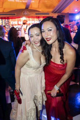 Two women posing for a photo at the Vizcaya Ball party.