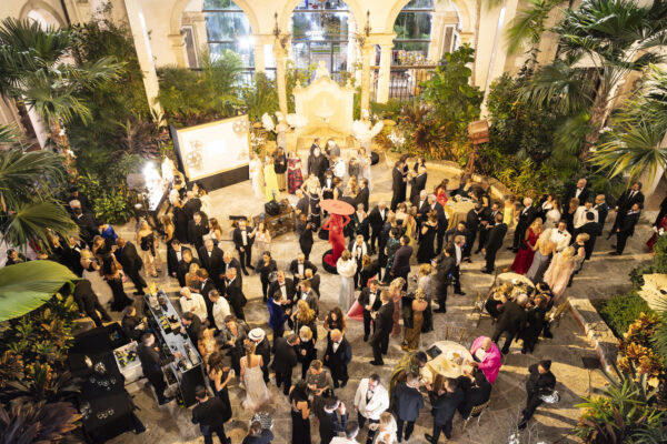 An aerial view of a large group of people at the Vizcaya Ball event.