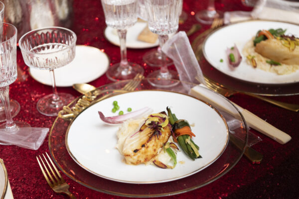 A white plate with food on it, beautifully presented at the Vizcaya Ball.
