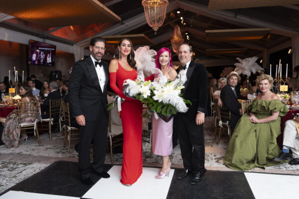 A group of people posing for a photo at the Vizcaya Ball, a formal event.