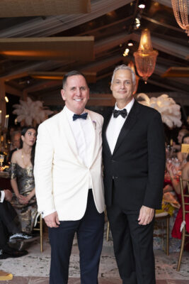 Two men in tuxedos standing next to each other at the Vizcaya Ball.