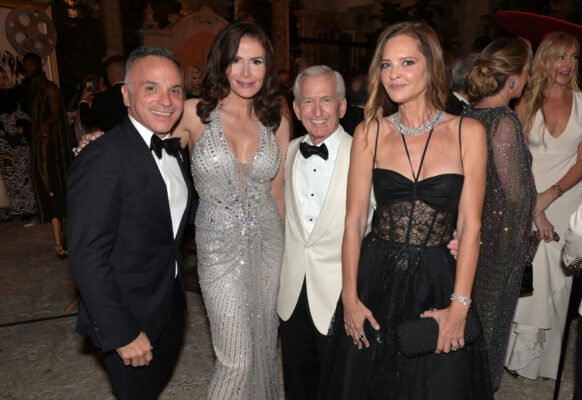 Four people posing for a photo at the Vizcaya Ball event.