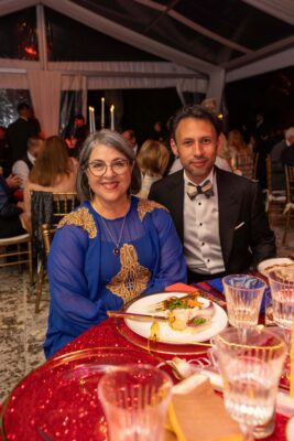 A man and woman posing for a photo at the Vizcaya Ball event.