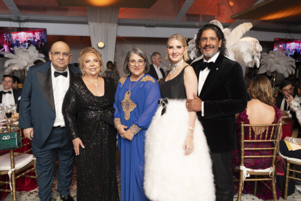 Attendees at the Vizcaya Ball posing for a photo during the formal event.