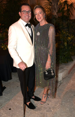 A man and woman standing next to each other at the Vizcaya Ball event.