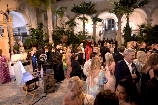 A group of people in formal attire at a Vizcaya Ball party.