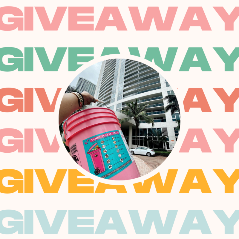 A person holding a pink bucket outside of a high-rise building with the words giveaway in rainbow colors.