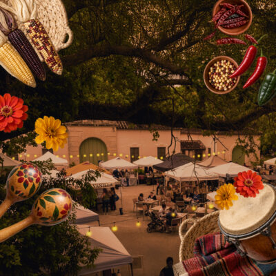 Vizcaya Village market with white tents, people walking, maracas, flowers, various corn and peppers, and a drum, set under large tree branches at dusk.